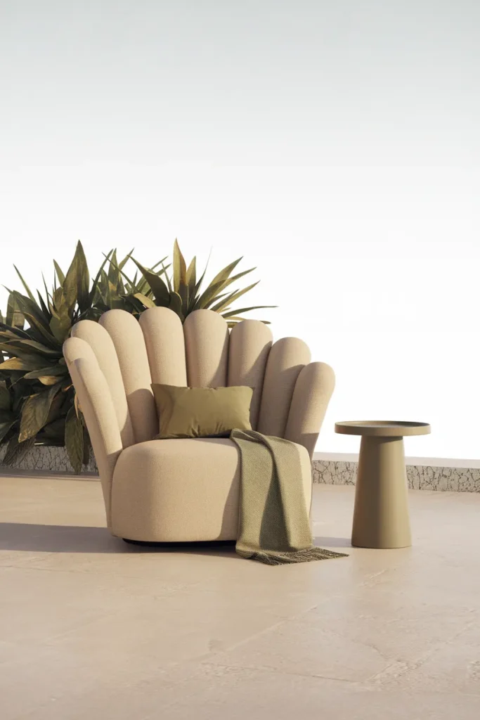 Modern outdoor furniture trend a curved scalloped lounge chair in a soft sand tone