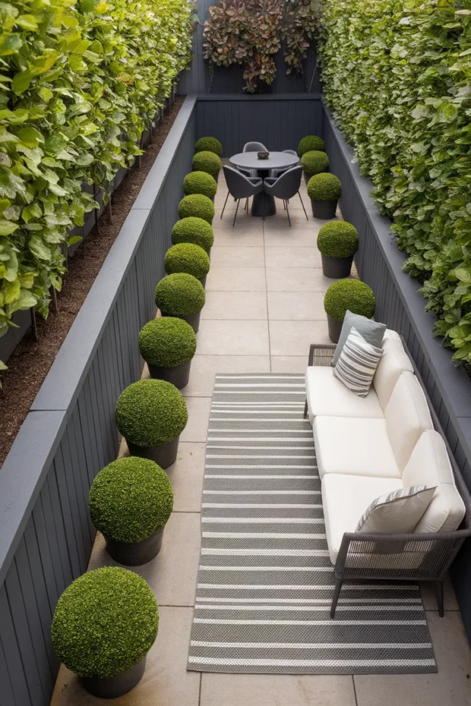 Narrow patio furniture layout with a perpendicular sofa breaking up a long galley space