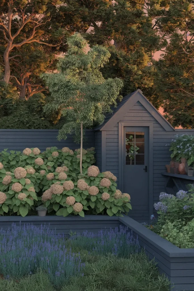 Cottage garden shed layered with a small tree, shrubs, and perennials for scale