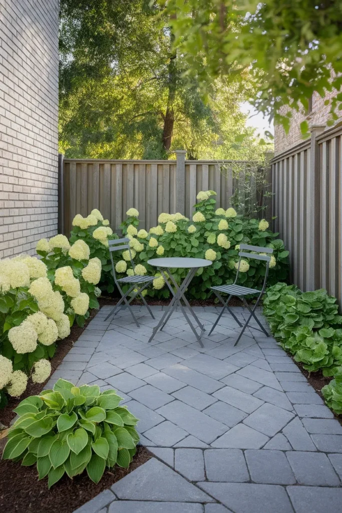 Narrow backyard makeover diagonal paver patio angled 45 degrees against the fence