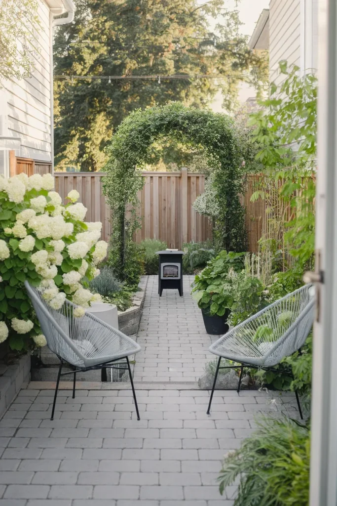 Narrow backyard makeover with a diagonal paver patio and fire pit in a long lot