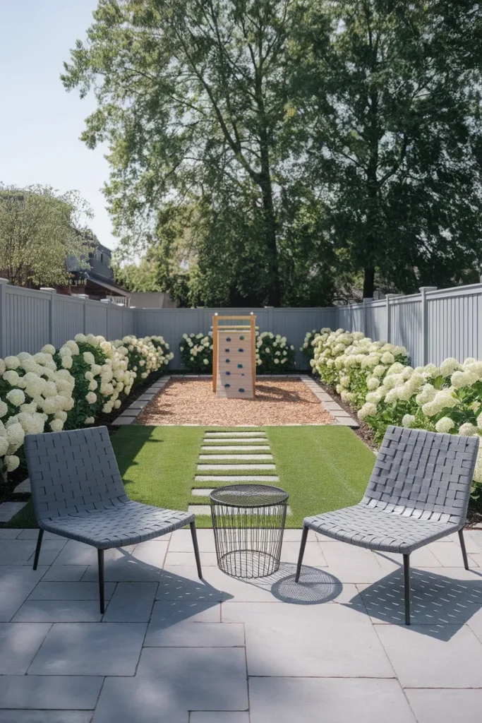 Small backyard kids play zone seen from the adult patio seating