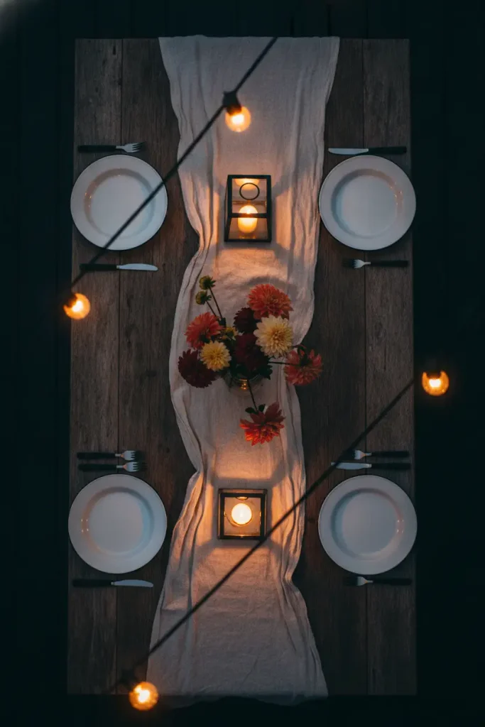 Outdoor lighting makeover ideas shown over a set table lit by warm cafe string lights